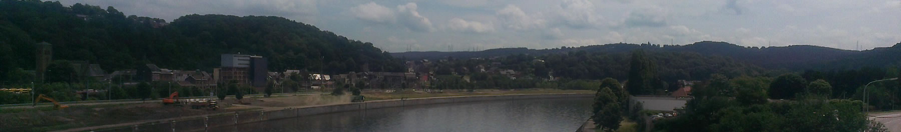 Banner showing view of river from bridge in a town