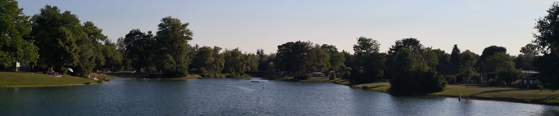 Banner showing view of lake at campsite