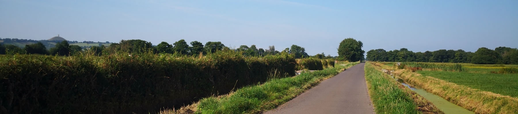 Banner showing view with Glastonbury Tor in the distance